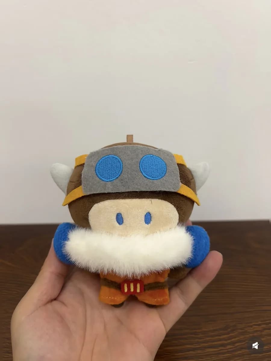 Blue character mascot plush with a moulded cap