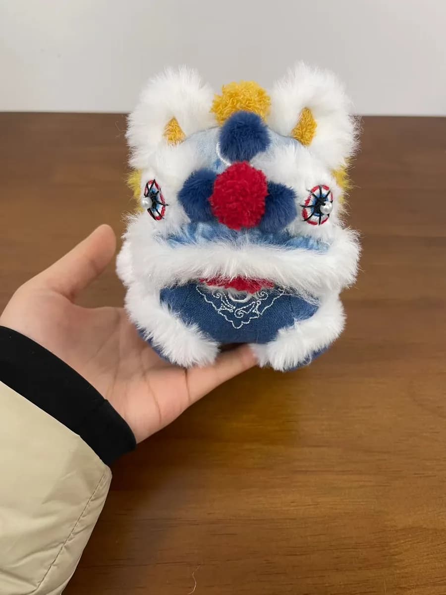Blue lion dance plush souvenir with fringe trim