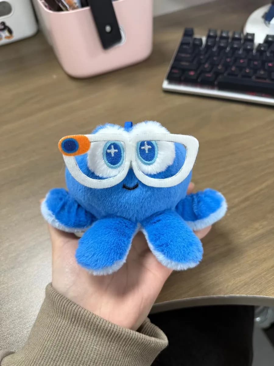Blue monster plush toy with oversized eyes