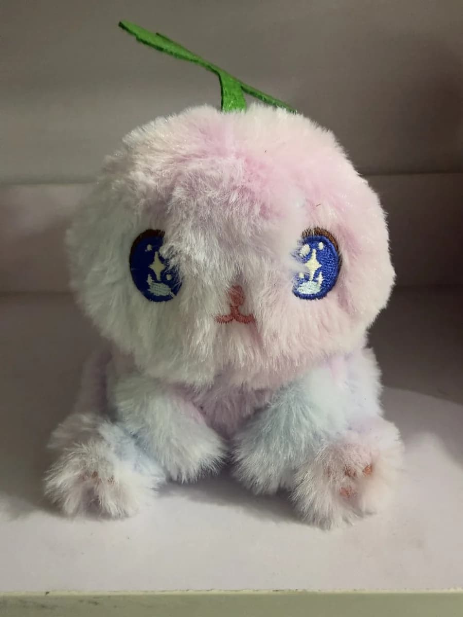 Fluffy cotton doll with hand-embroidered eyes