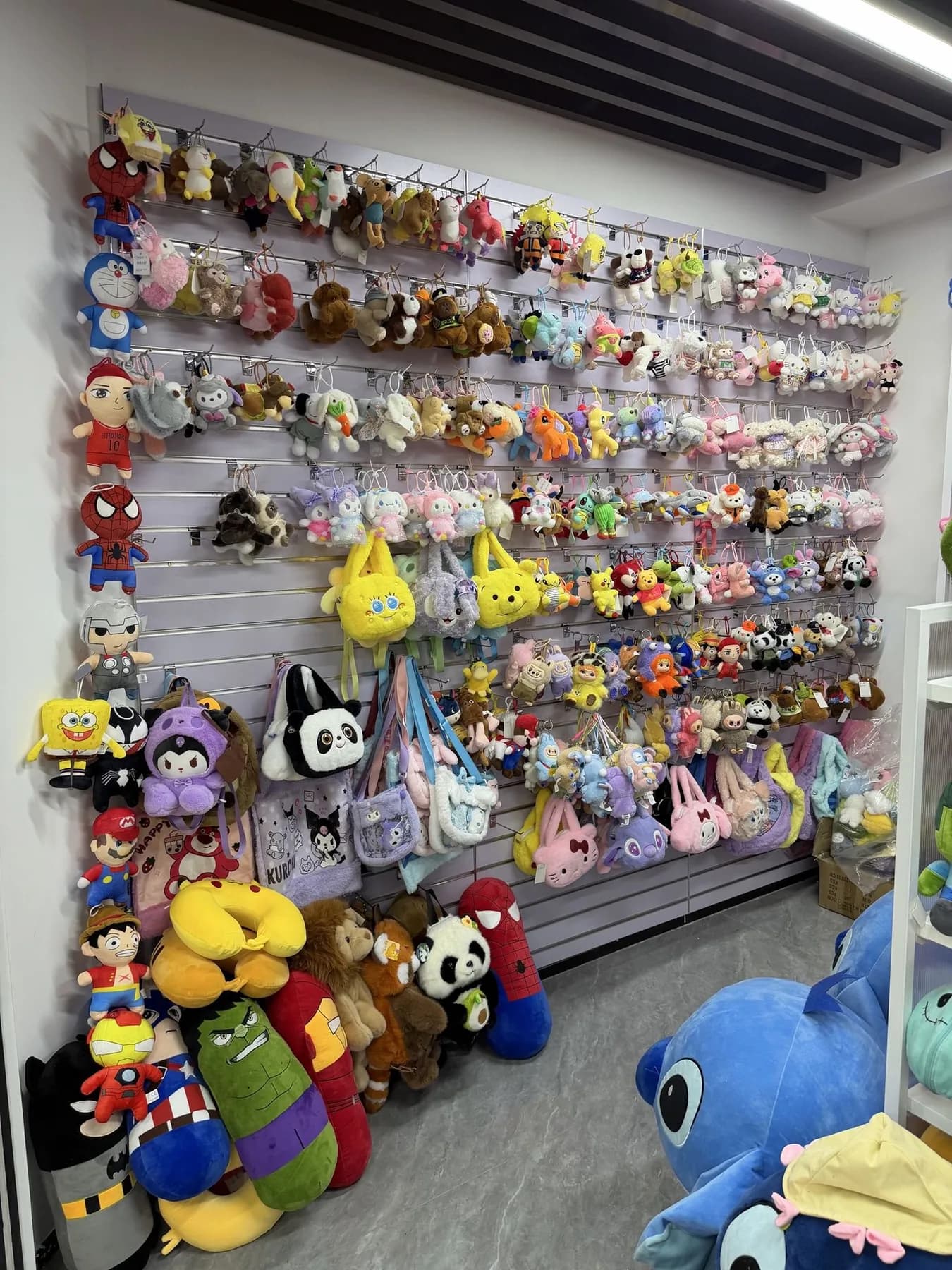 Sample wall of custom plush keychains in our Shenzhen showroom