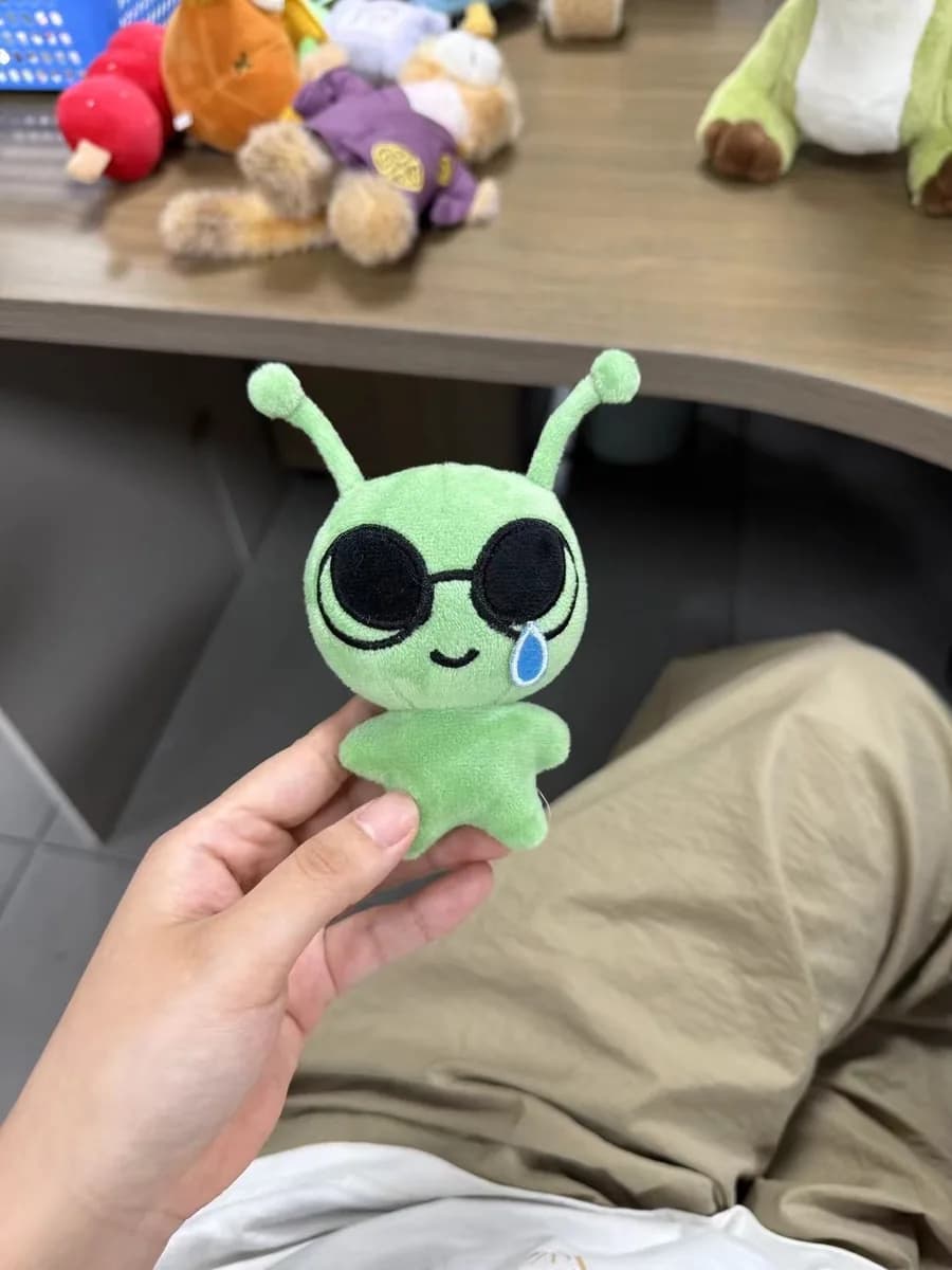 Green alien plush keychain with plastic safety eyes