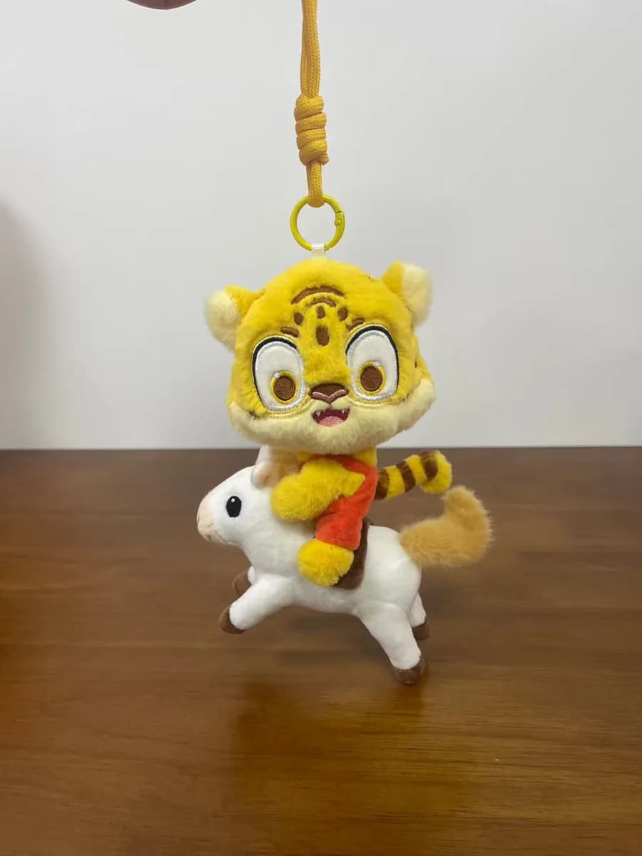 Tiger face plush keychain in yellow and black