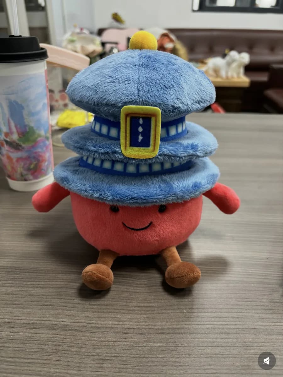 Burger character plush toy with a moulded cap