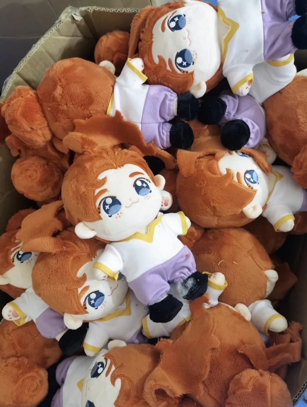 Bulk run of character dolls before hangtag attachment