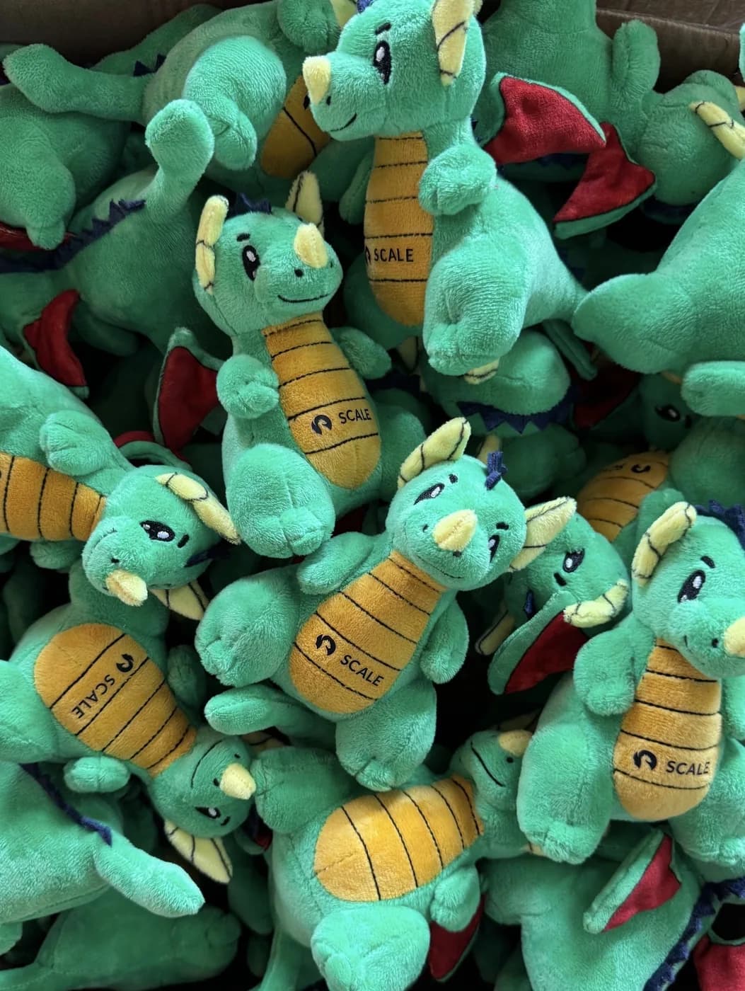 Bulk run of green dragon plush toys