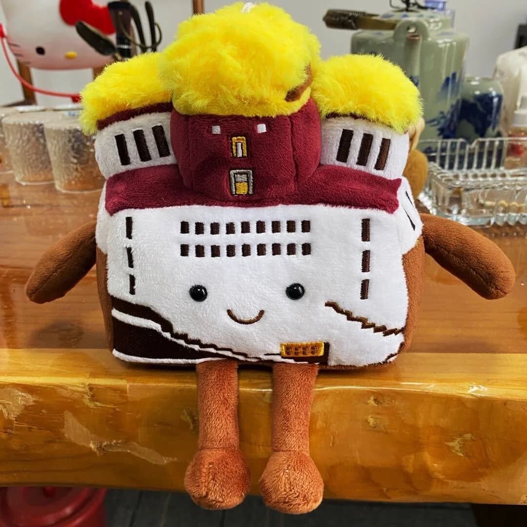 Large castle plush souvenir with appliqué stonework